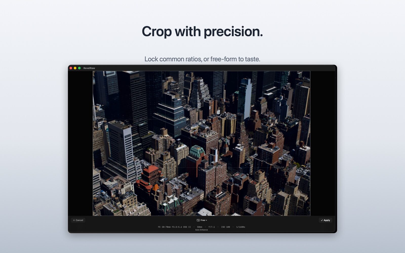 RevelRaw crop tool: a free-form crop frame with an aspect-ratio selector and Cancel and Apply controls over a city-skyline photograph.